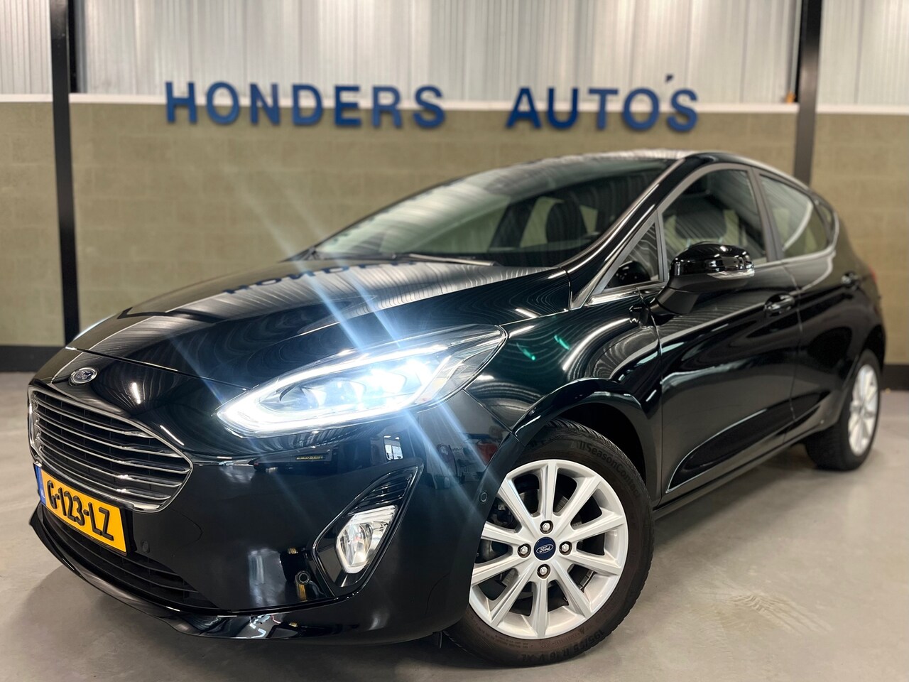 Ford Fiesta - 1.0 EcoBoost Titanium AUT I CARPLAY I 1E EIG I NAVI I VOORRUITVERW I NAP I CRUISE I FULL-L - AutoWereld.nl