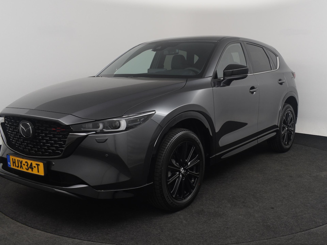 Mazda CX-5 - e-Skyactiv-G 165 Homura | 19-inch lichtmetalen velgen, Black Metallic | 360° View Monitor - AutoWereld.nl
