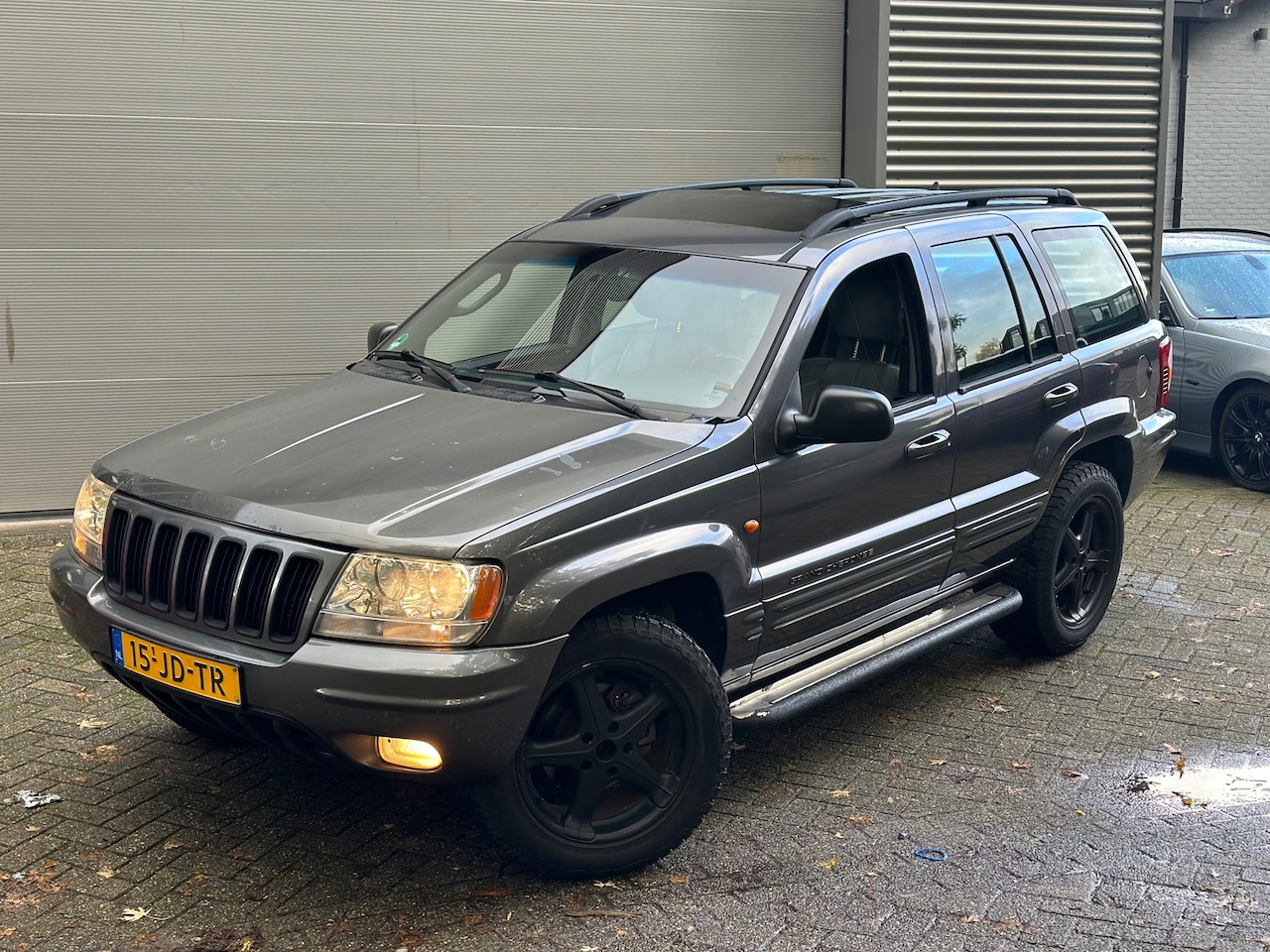 Jeep Grand Cherokee - 4.7i V8 / SCHUIFKANTELDAK / AUTOMAAT / NIEUWE BANDEN - AutoWereld.nl