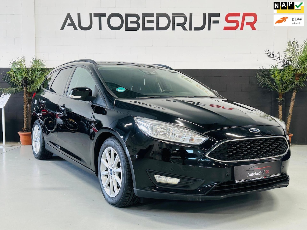 Ford Focus Wagon - 1.0 Titanium Edition Trekhaak! Cruise Controle! Navigatie! PDC! Stoelverwarming! - AutoWereld.nl