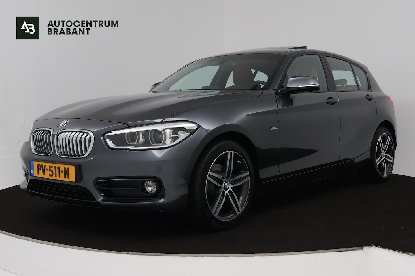 BMW 1-serie - 118i Corporate Lease High Executive (PANORAMADAK, STOELVERWARMING, AUTOMAAT, CRUISE CONTRO - AutoWereld.nl
