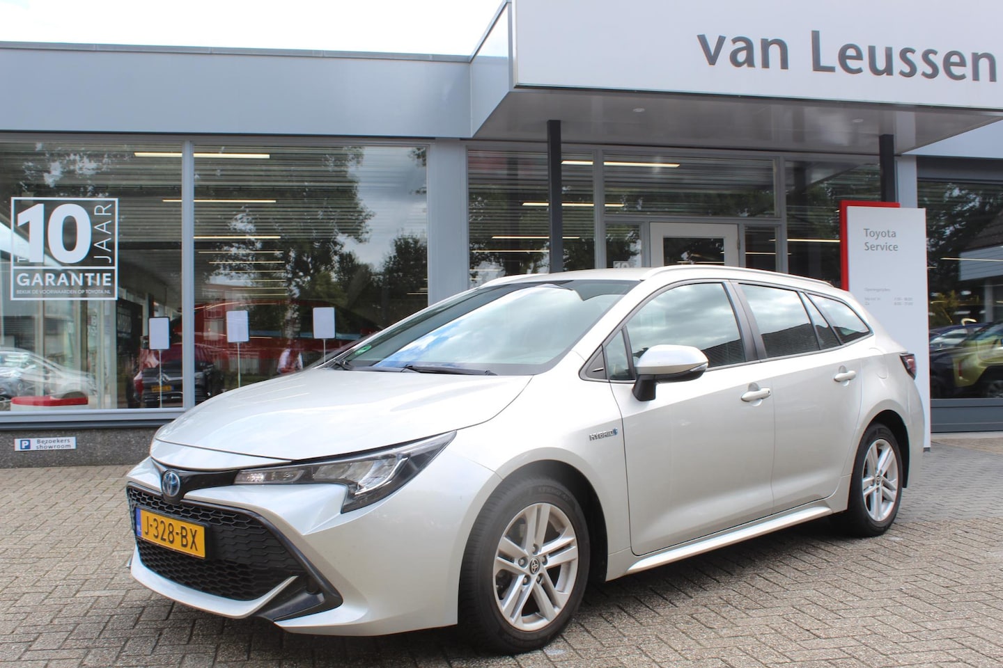 Toyota Corolla Touring Sports - 1.8 HYBRID CLIMA DAB AD-CRUISE APPLE / ANDROID EL-SPIEGELS & RAMEN - AutoWereld.nl