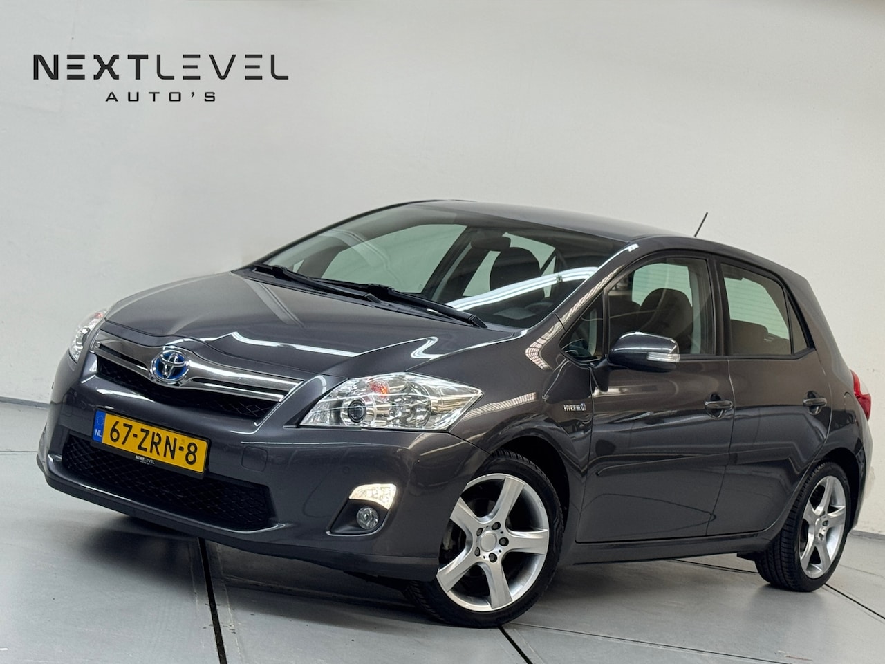 Toyota Auris - 1.8 Full Hybrid Limited Aut Navi Camera Trekhaak - AutoWereld.nl