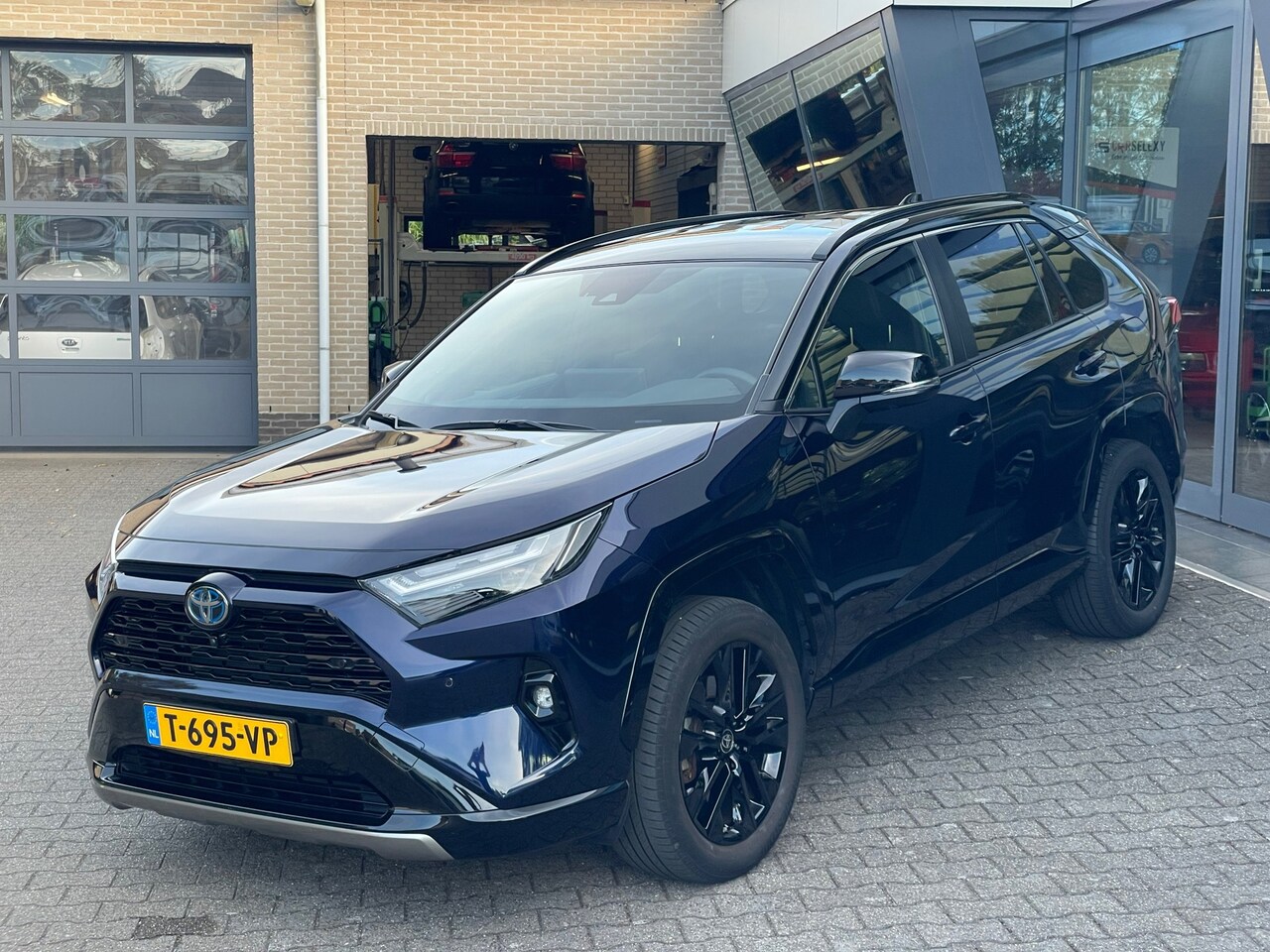 Toyota RAV4 - 2.5 Hybrid AWD Style aut two tone - AutoWereld.nl