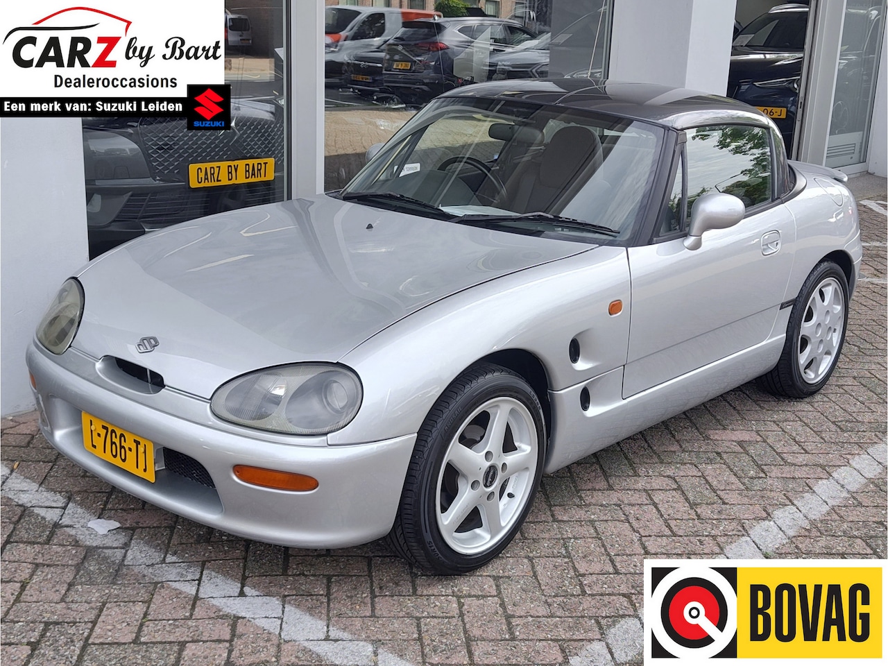 Suzuki Cappuccino - 0.7 ROADSTER AUTOMAAT (!!) Airco! | Hardtop | Elek. ramen | Momo stuur - AutoWereld.nl