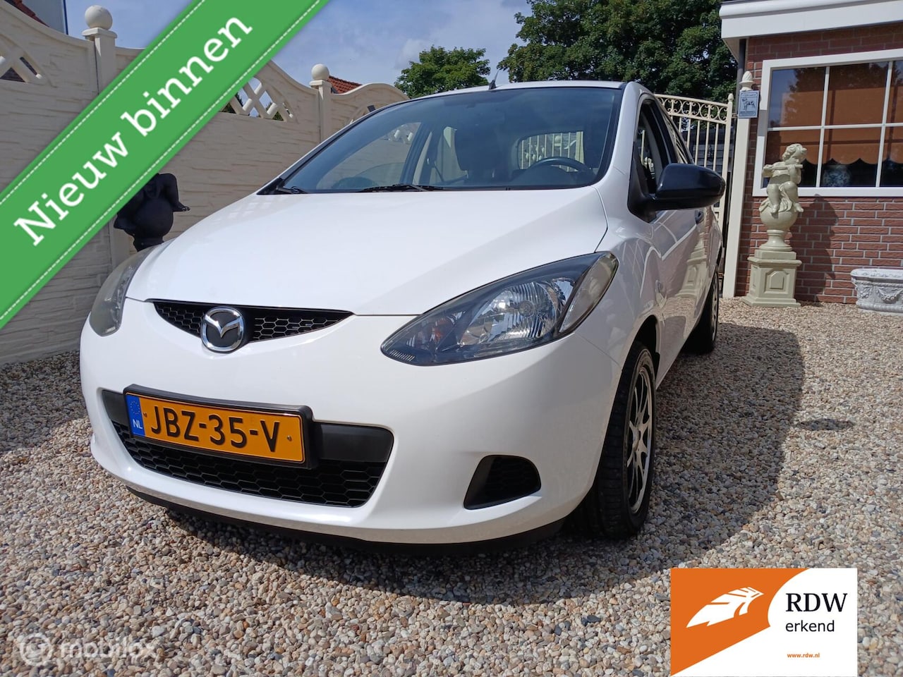 Mazda 2 - 1.3 white edition geen airco - AutoWereld.nl