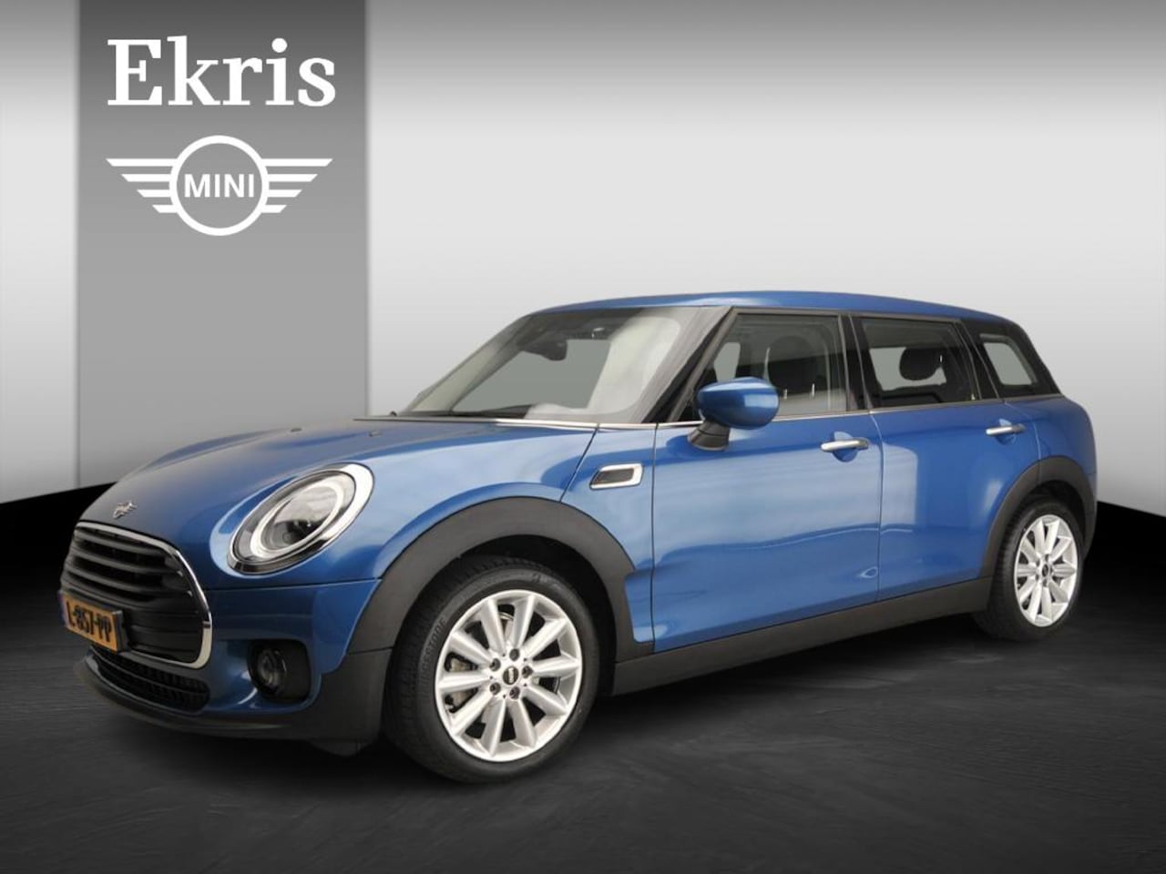 MINI Clubman - Cooper Sportstoelen / Half leder / LED / PDC / Cruise / Navigatie / Alu wielen 17 inch - AutoWereld.nl
