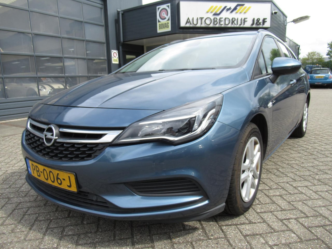Opel Astra Sports Tourer - 1.4 Online Edition / NAV / PDC 2x / Airco / Achteruitrijcamera - AutoWereld.nl