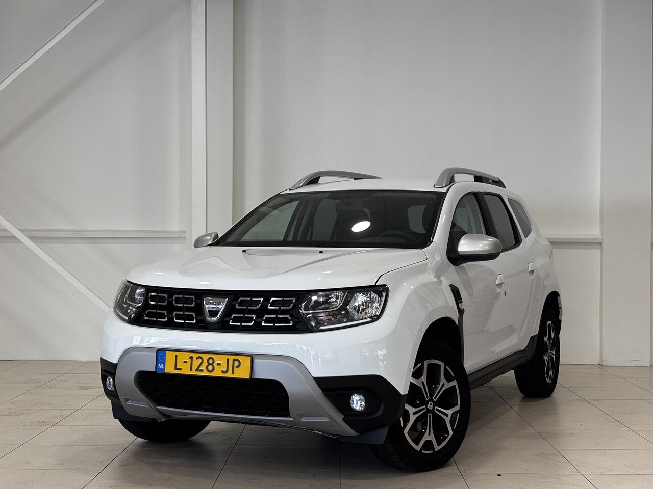 Dacia Duster - 1.3 TCe Prestige | Airco | Hoge instap | Navigatie | Camera - AutoWereld.nl