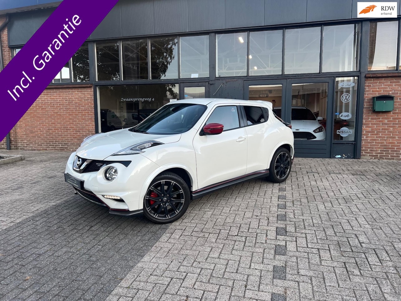 Nissan Juke - 1.6 DIG-T Nismo RS 1.6 DIG-T Nismo RS, 4X4, Parelmoer wit, Dealer onderhouden - AutoWereld.nl