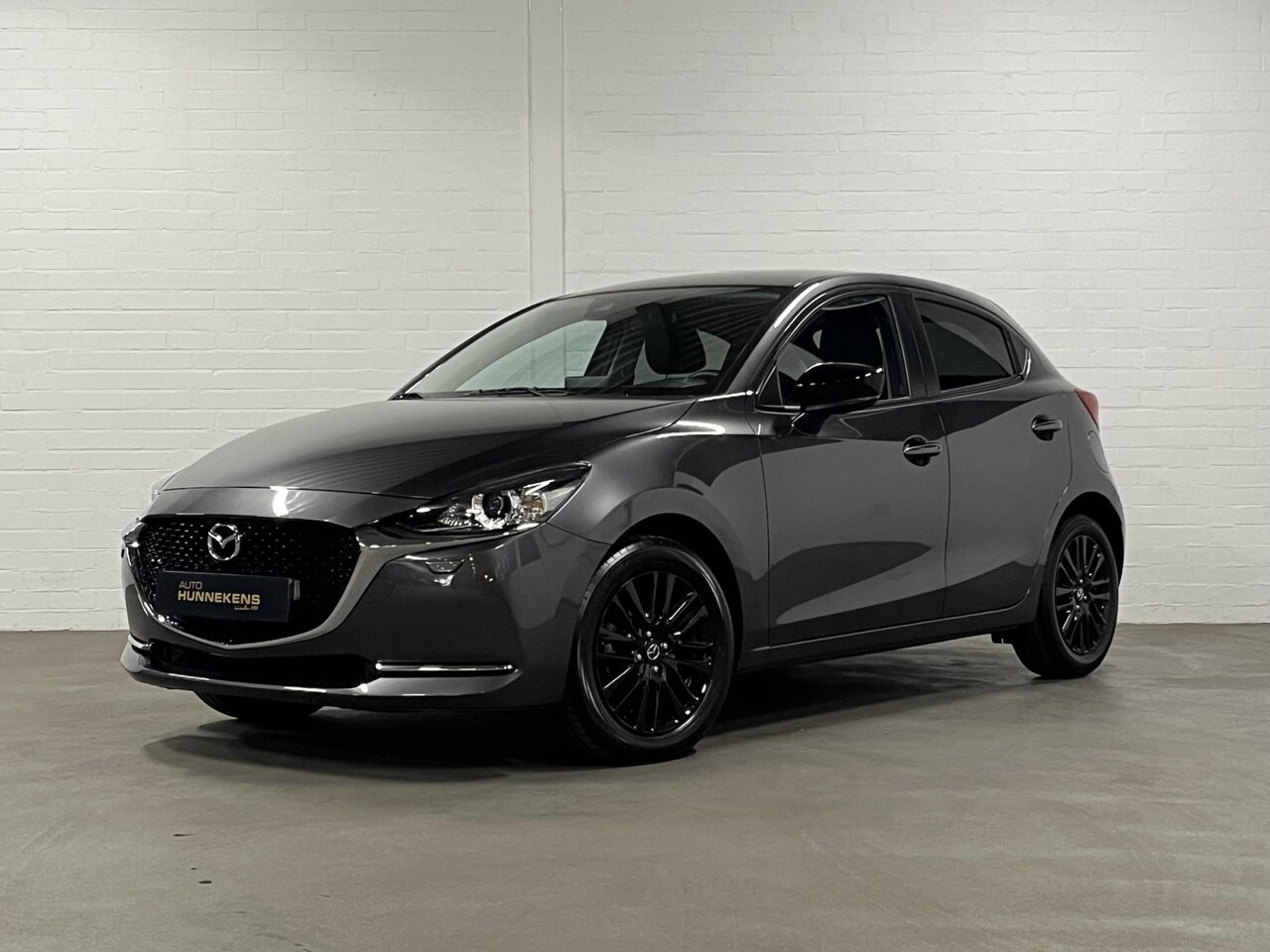 Mazda 2 - 1.5 Homura | Cruise Control | Stoelverwarming | Airco | Navigatie | Carplay | - AutoWereld.nl