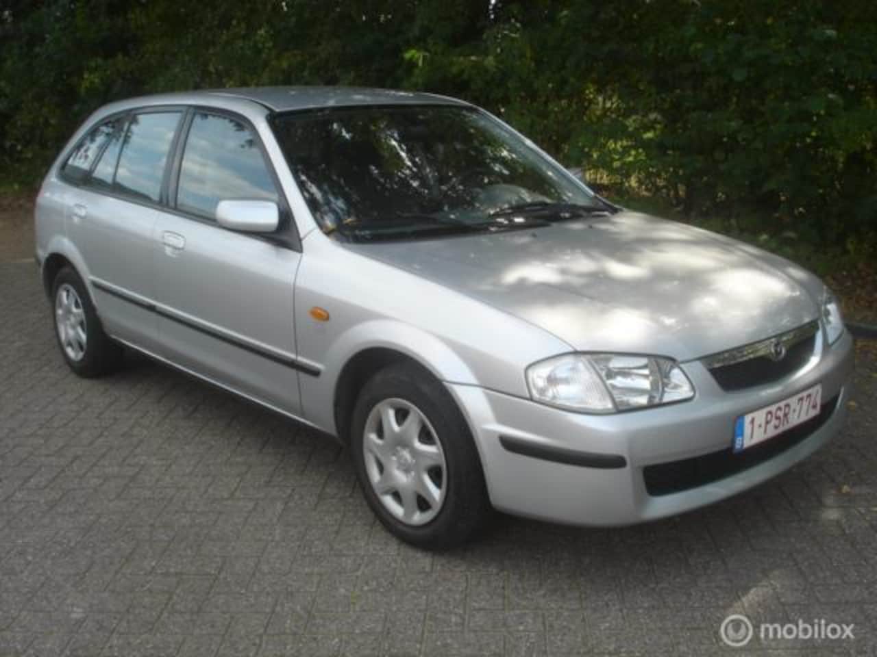 Mazda 323 Fastbreak - 1.5 I 65 KW TSI 5 deurs 196973 KM - AutoWereld.nl