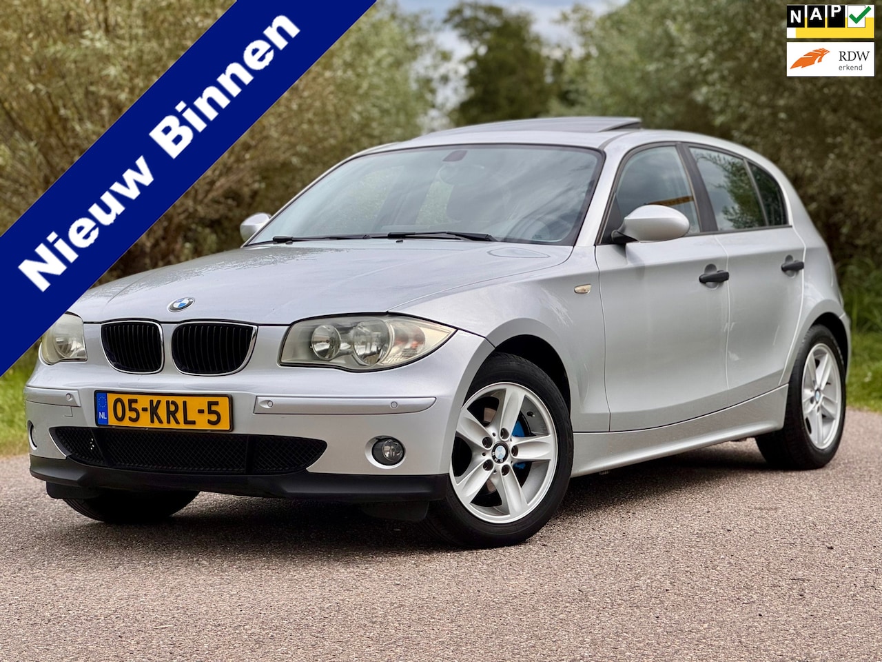 BMW 1-serie - 118i High Executive Automaat Clima Stoelverwarming Navi van A/Z Onderhouden - AutoWereld.nl
