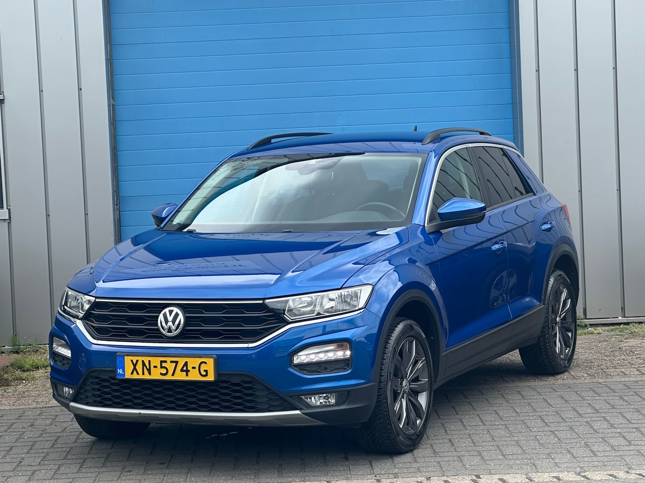 Volkswagen T-Roc - 1.0 TSI NAVI PDC TREKHAAK - AutoWereld.nl