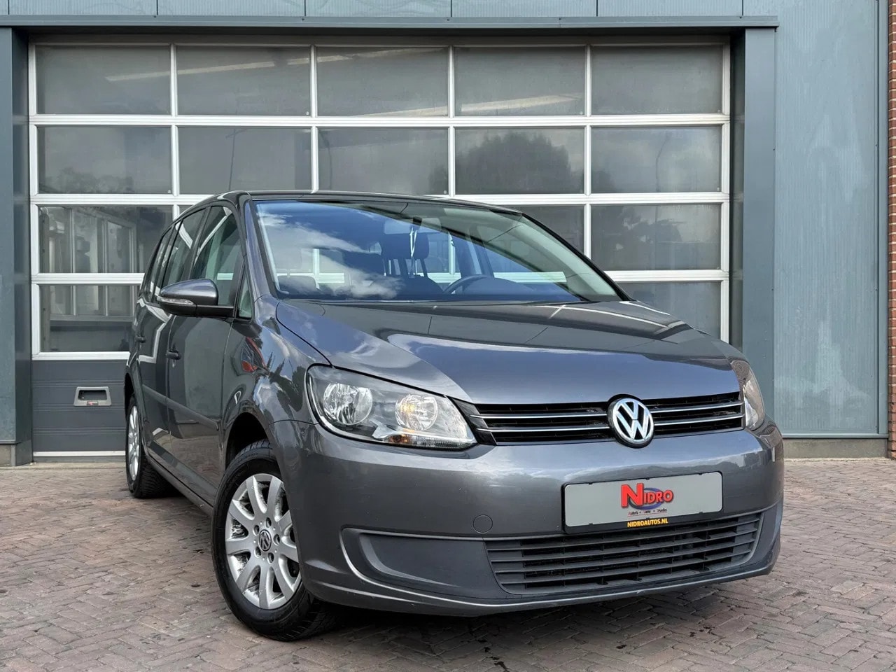 Volkswagen Touran - 1.2 TSI 105pk 7 Persoons Lmv Parkeer sensoren - AutoWereld.nl