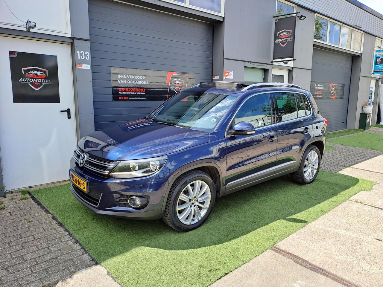Volkswagen Tiguan - 1.4 TSI Sport&Style Pano Cruise Clima PDC - AutoWereld.nl