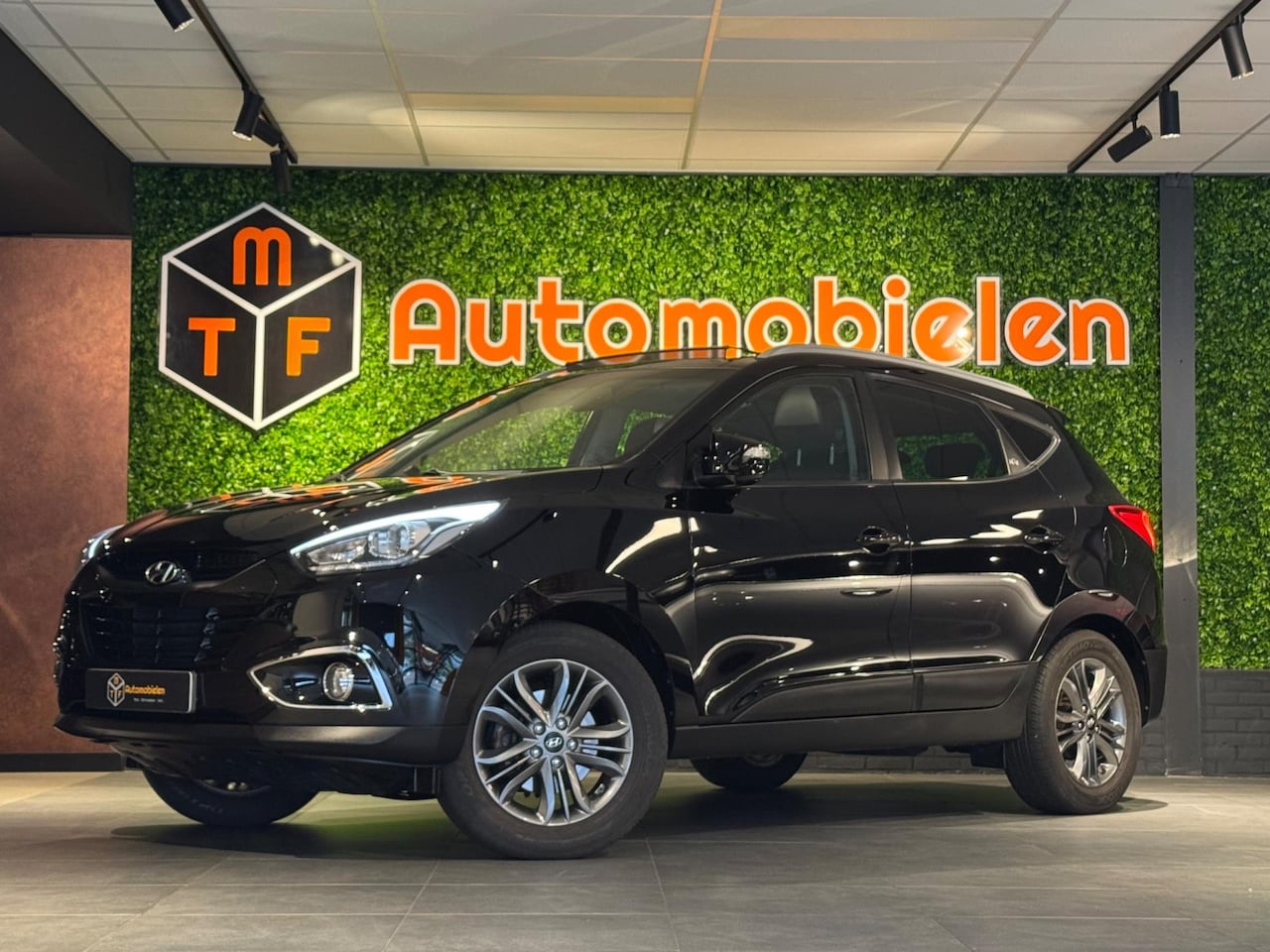 Hyundai ix35 - 1.6i GDI i-Motion |PANO|CAMERA|NAVI|TREKHAAK|STOELVERWARMING - AutoWereld.nl