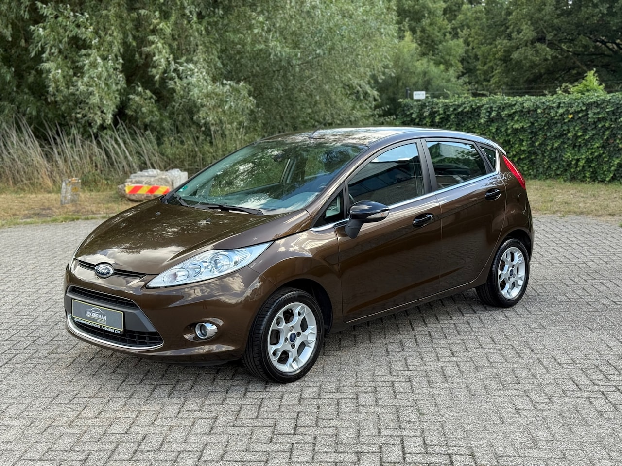 Ford Fiesta - 1.25 Titanium 82PK I NIEUWE DISRIEM I PDC I AIRCO I NWE APK - AutoWereld.nl