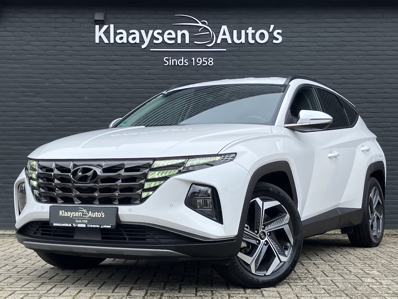 Hyundai Tucson - 1.6 T-GDI PHEV 265 pk Comfort Smart 4WD AUT. | 1e eigenaar | navigatie | elektr. a. klep | - AutoWereld.nl