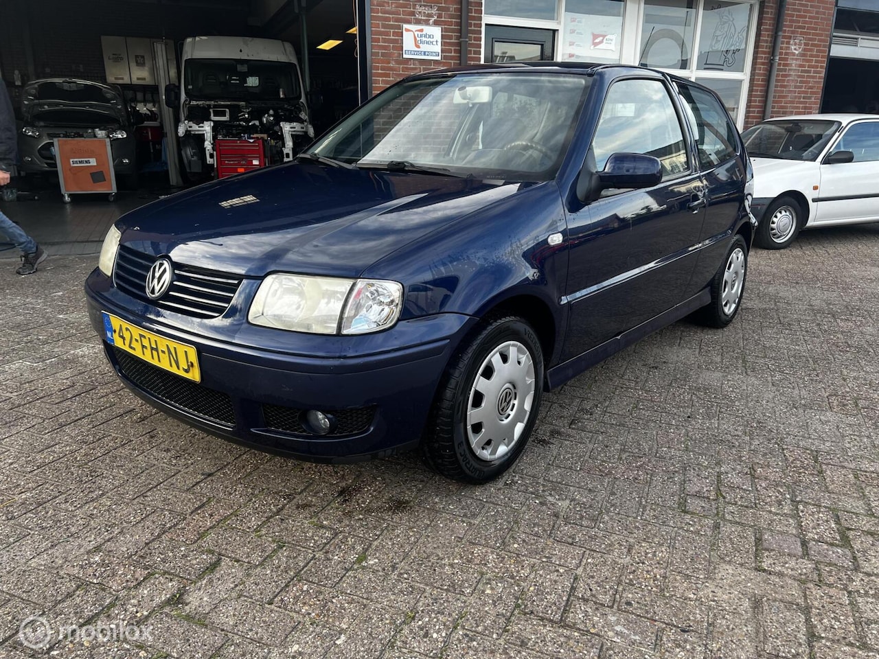 Volkswagen Polo - 1.4-16V Highline automaat - AutoWereld.nl