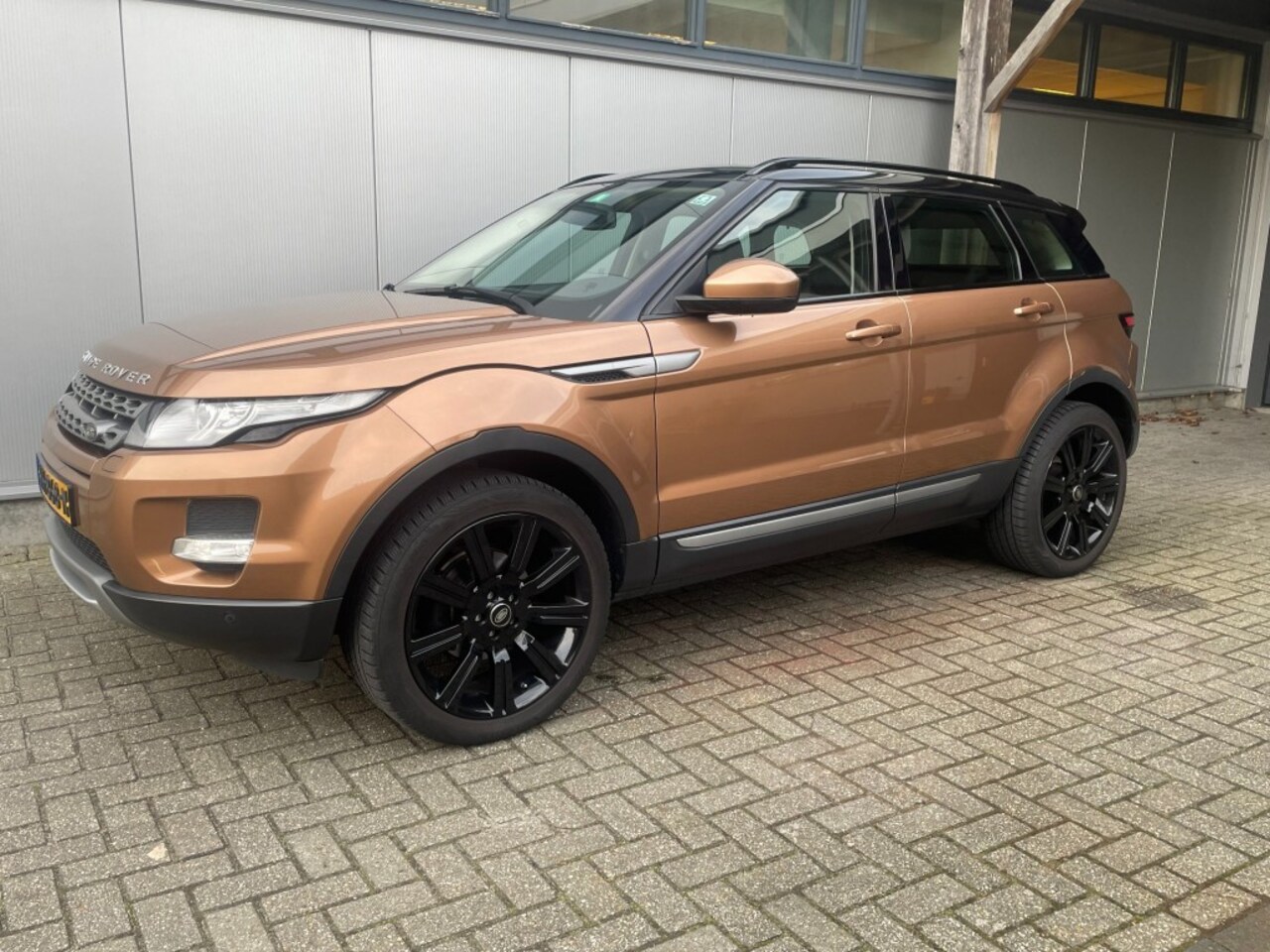 Land Rover Range Rover Evoque - 2.0 SI 4WD SIC. YEL.  Met schuifdak - AutoWereld.nl