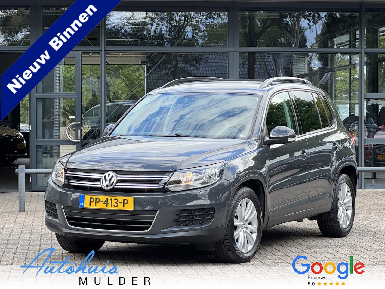 Volkswagen Tiguan - 2.0 TDI Sport&Style Clima/Cruise/Trekhaak/Stoelverwarming - AutoWereld.nl