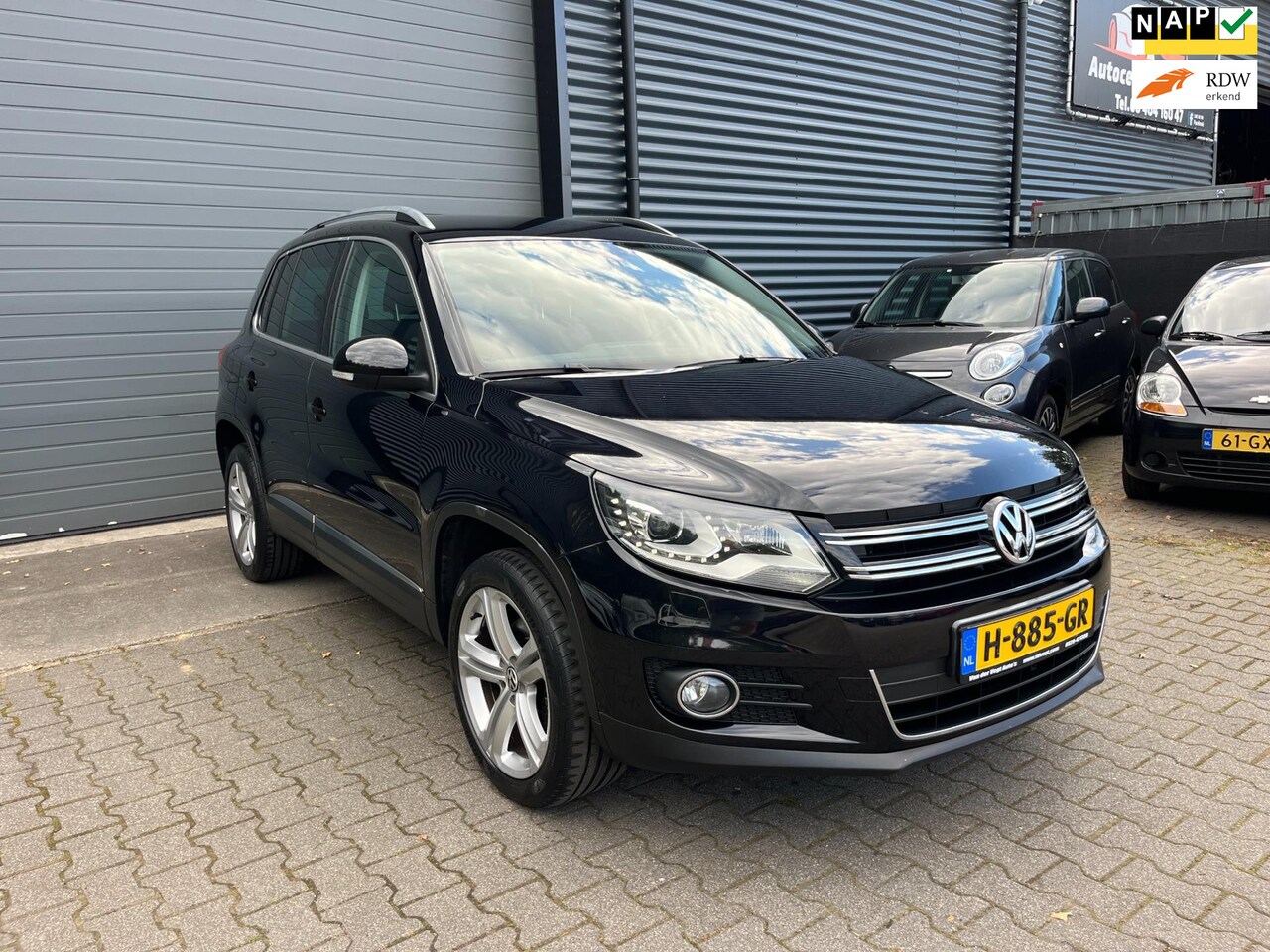 Volkswagen Tiguan - 2.0 TSI Sport&Style 4Motion TREKHAAK/XENON/APPLE CARPLAY - AutoWereld.nl