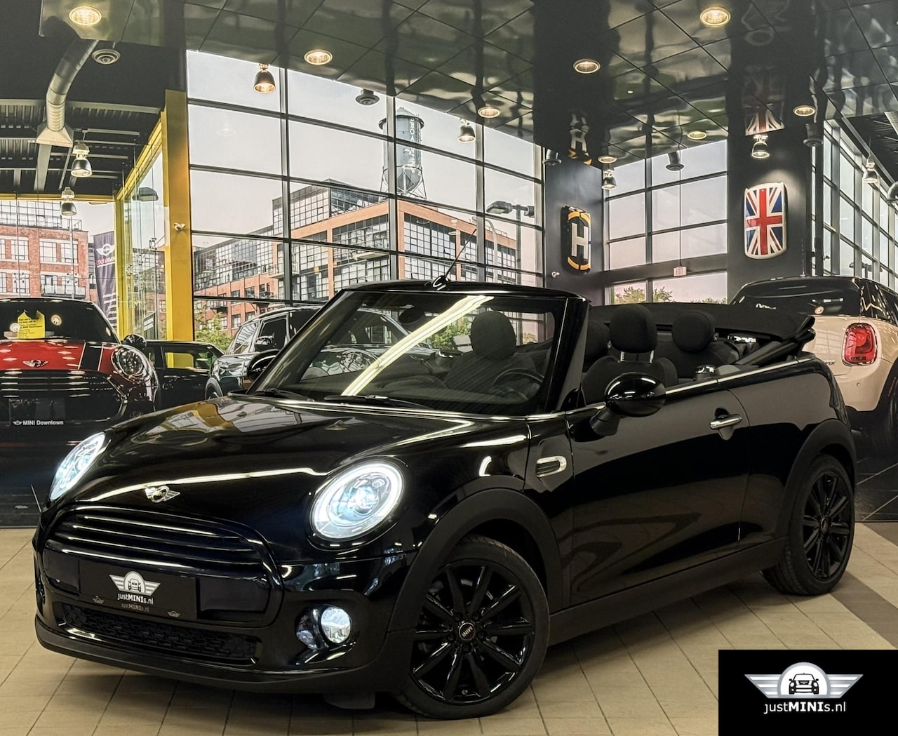 MINI Cabrio - COOPER AUT 136 pk 1 EIG NAVI H-LEDER UNION JACK MINI COOPER CABRIO AUT 136 pk 1 EIG NAVI L - AutoWereld.nl