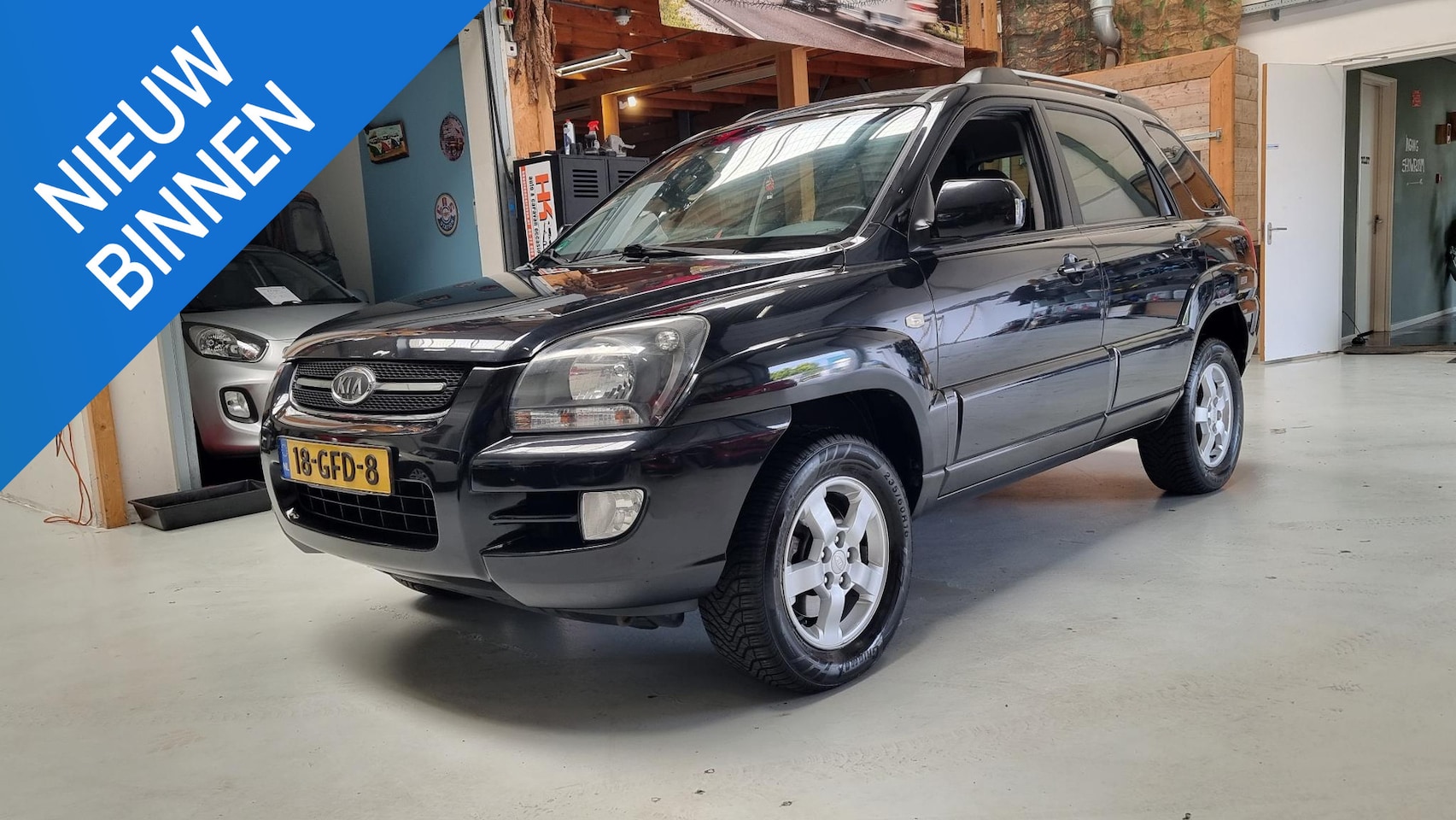 Kia Sportage - 2.0 CVVT All Stars Navi, Bluetooth, Airco, LMV - AutoWereld.nl