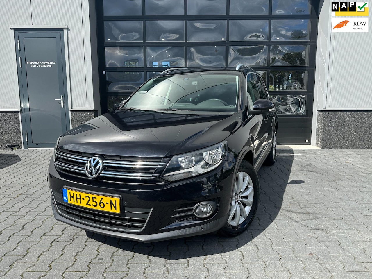 Volkswagen Tiguan - 1.4 TSI Sport&Style 1 ste eigenaar vol dealer onderhouden - AutoWereld.nl