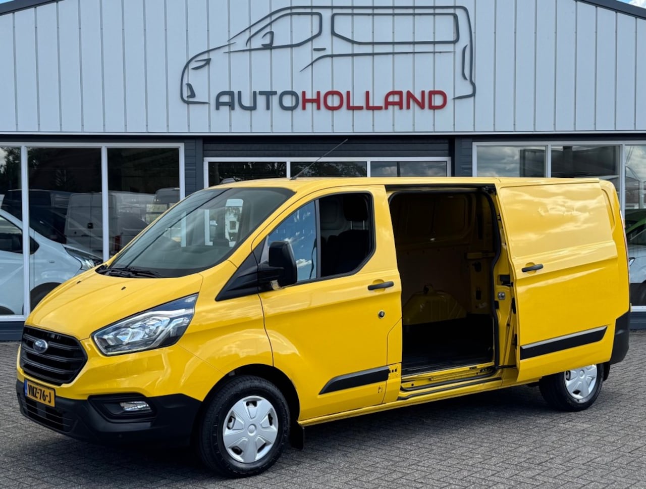 Ford Transit Custom - 2.0 TDCI 77KW 105PK L2H1 EURO 6 AIRCO/ NAVIGATIE/ CRUISE CONTROL/ TREKHAAK/ 100% DEALEROND - AutoWereld.nl