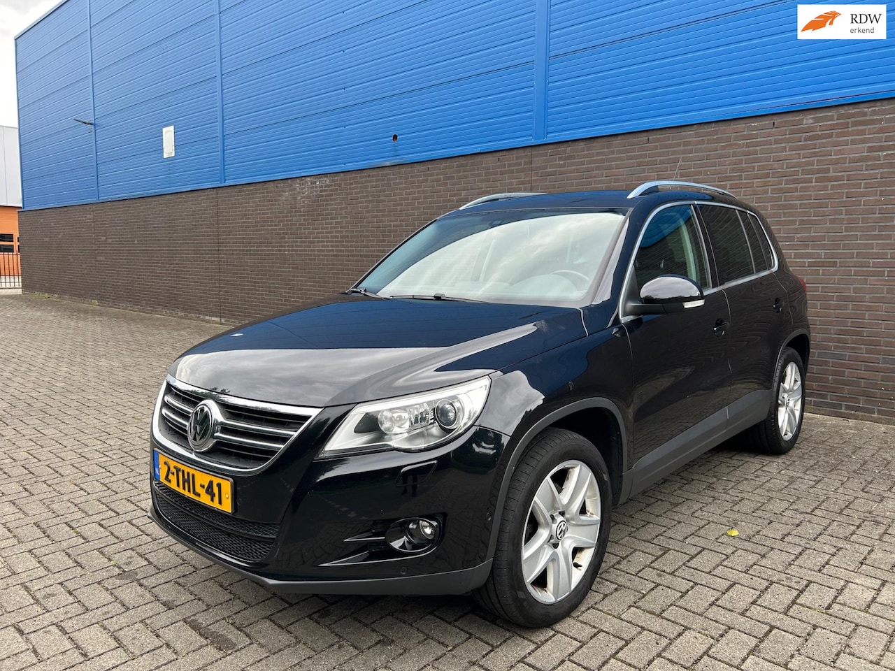 Volkswagen Tiguan - 2.0 TSI Sport&Style 4Motion | Pano | Cruise | Leer | Park Assist | Camera | Climate | Auto - AutoWereld.nl