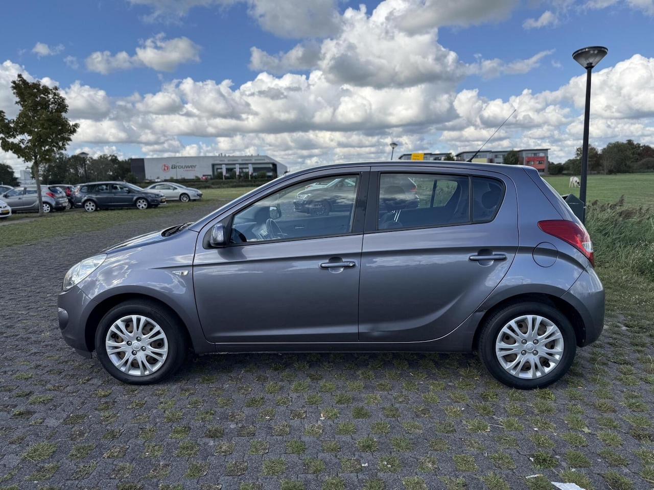 Hyundai i20 - 1.2i 2009 5-deurs BT Scherm Airco Dealer ondh - AutoWereld.nl