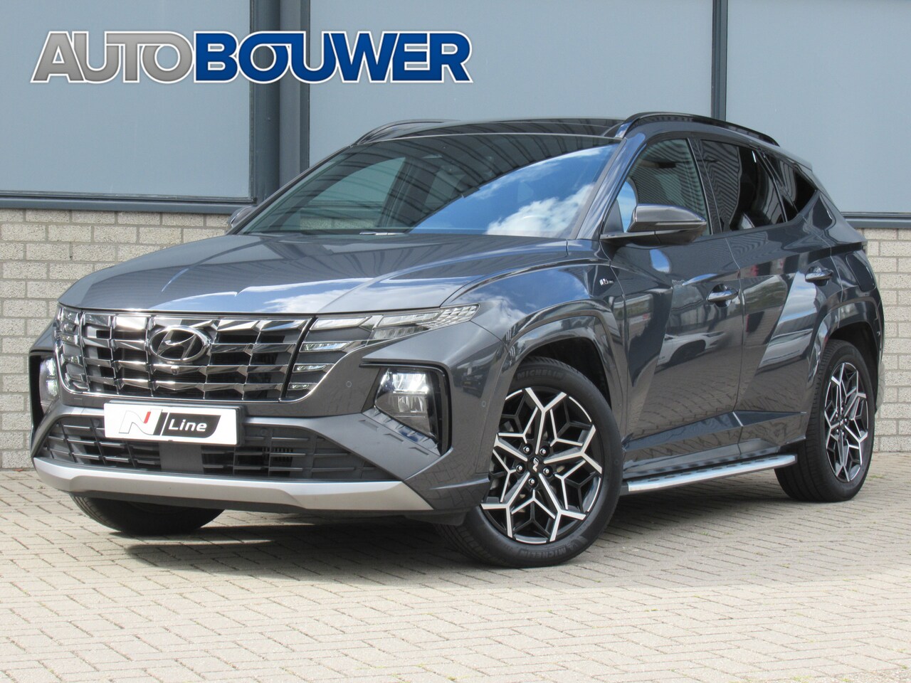 Hyundai Tucson - 1.6 T-GDI HEV 230 PK N Line Sky 1e eigen | dealer onderh | full options | 1650 kg tr.gewic - AutoWereld.nl