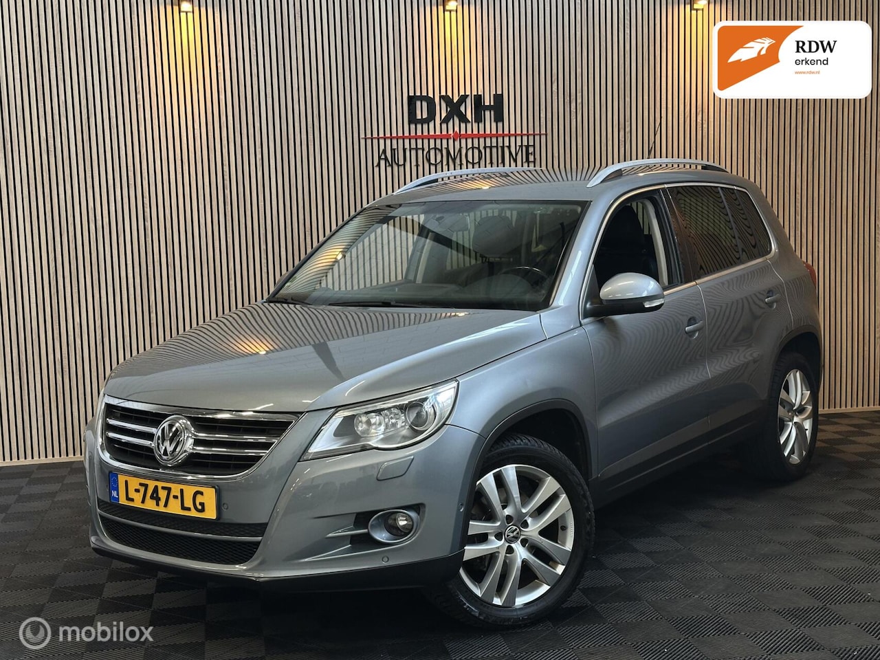 Volkswagen Tiguan - 2.0 TSI DSG Sport&Style 4Motion NAVI LEDER - AutoWereld.nl