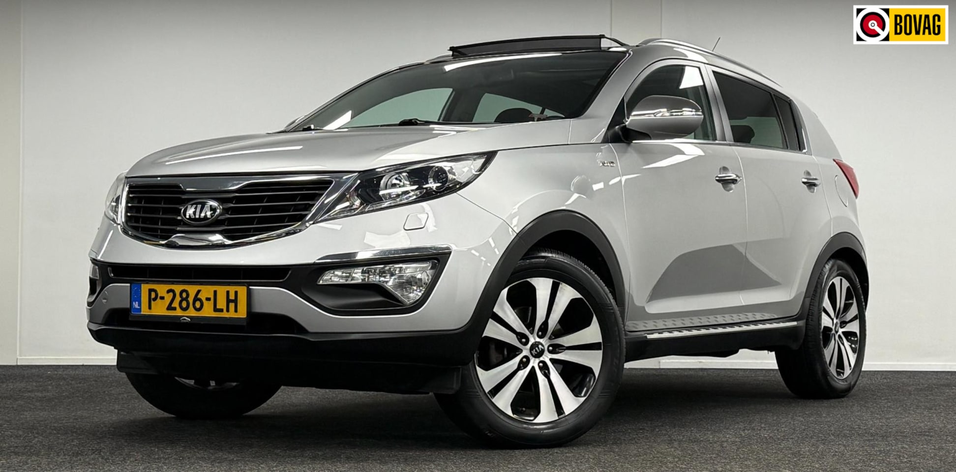 Kia Sportage - 2.0 Super Pack AWD*Automaat*Panodak*Trekhaak*Leder*Xenon - AutoWereld.nl
