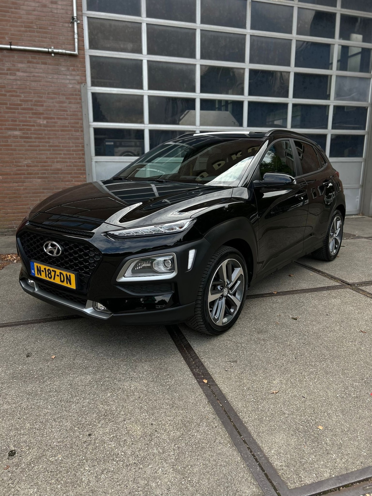 Hyundai Kona - 1.0 T-GDI Premium 1.0 T-GDI Premium,NAVI,CRUISE,CLIMAT,18INCH,CAMERA,HALFLEER,SCHUIFDAK,APPLECARPLAY - AutoWereld.nl