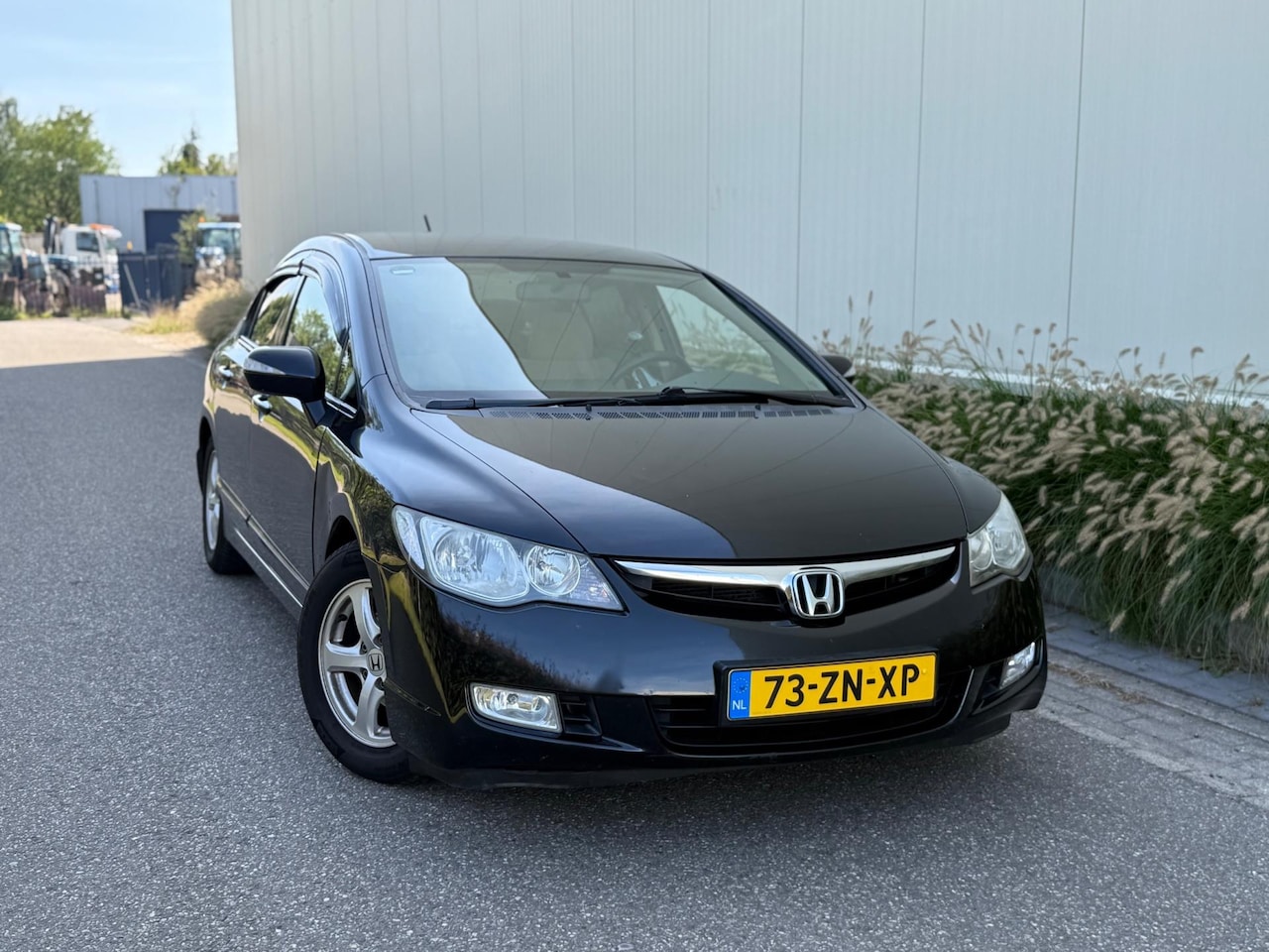 Honda Civic - 1.3 Hybrid (bj 2008) AUTOMAAT|CAMERA|NAVI|ALL-SEASONS - AutoWereld.nl
