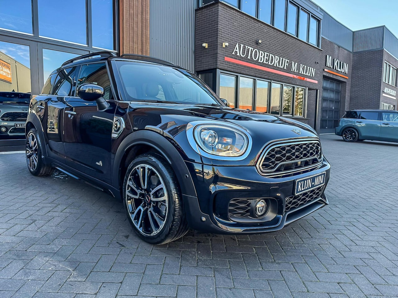 MINI Countryman - Mini 2.0 Cooper S E ALL4 Chili John Cooper Works 224pk/Pano/Lounge leer/19"Jcw - AutoWereld.nl