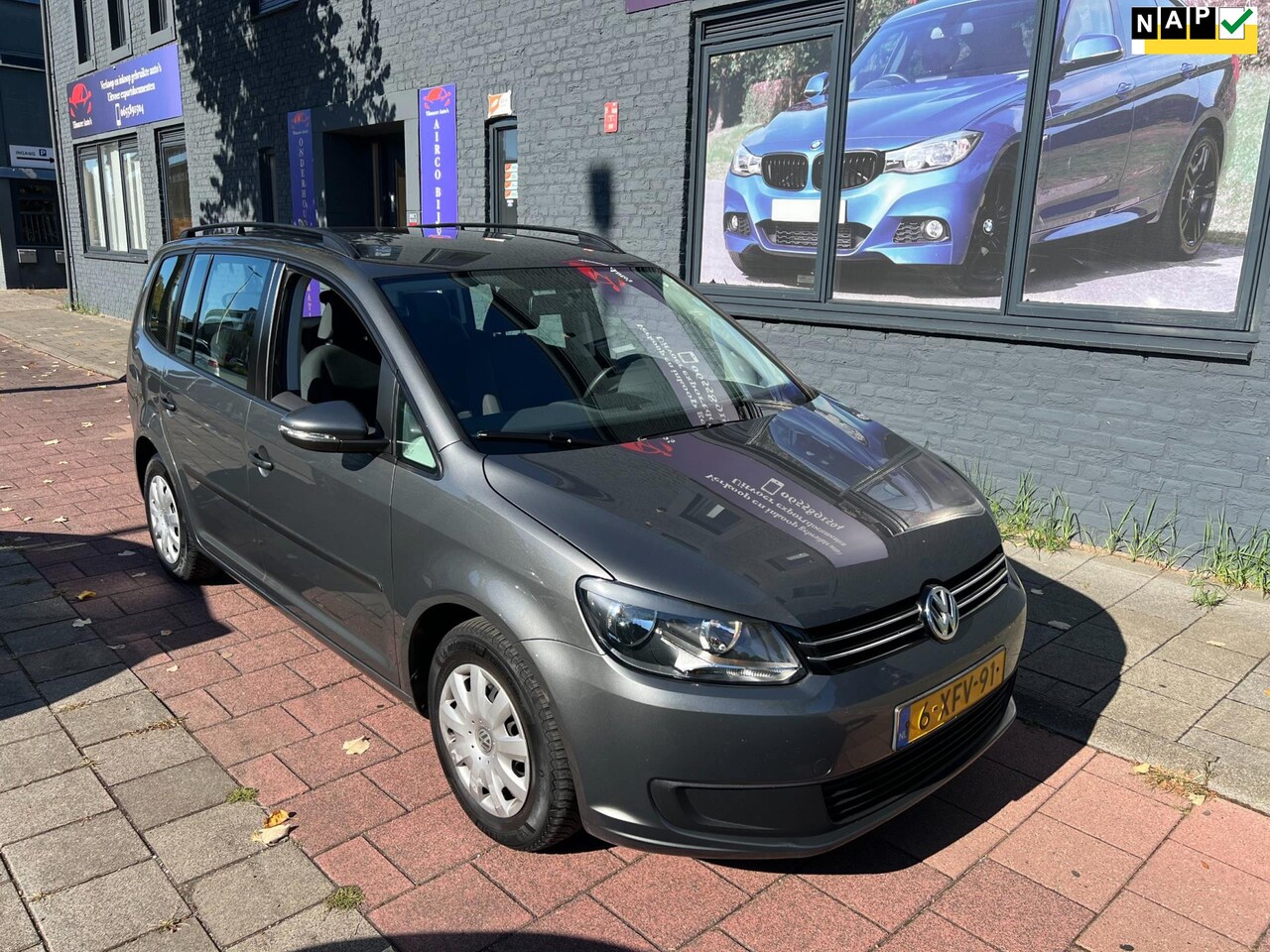 Volkswagen Touran - 1.2 TSI Trendline Bluemotion 7persoons navi nap boekjes - AutoWereld.nl