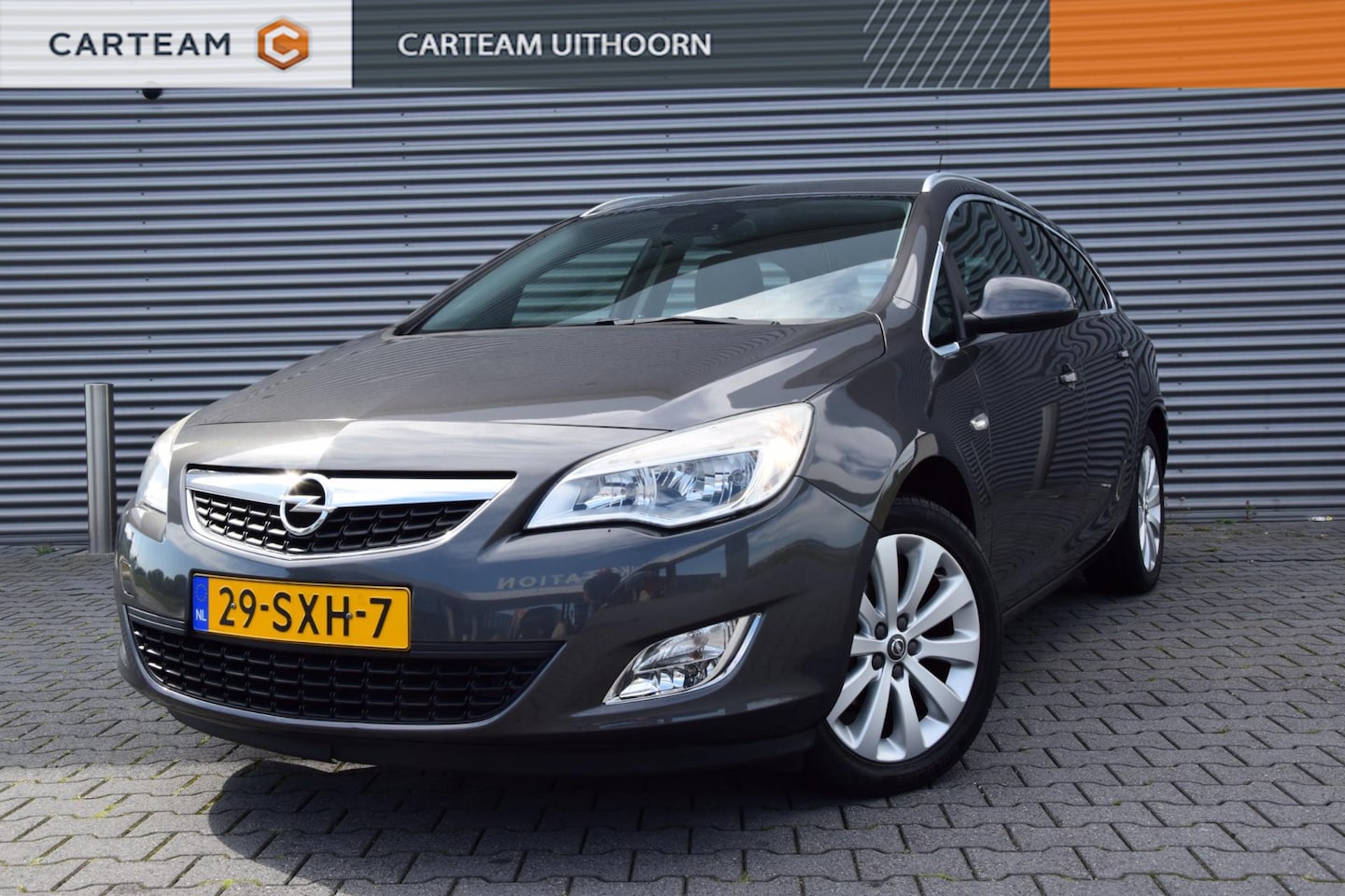 Opel Astra Sports Tourer - 1.4 Turbo Cosmo 1.4 Turbo Cosmo, 1e eigenaar, all season banden - AutoWereld.nl