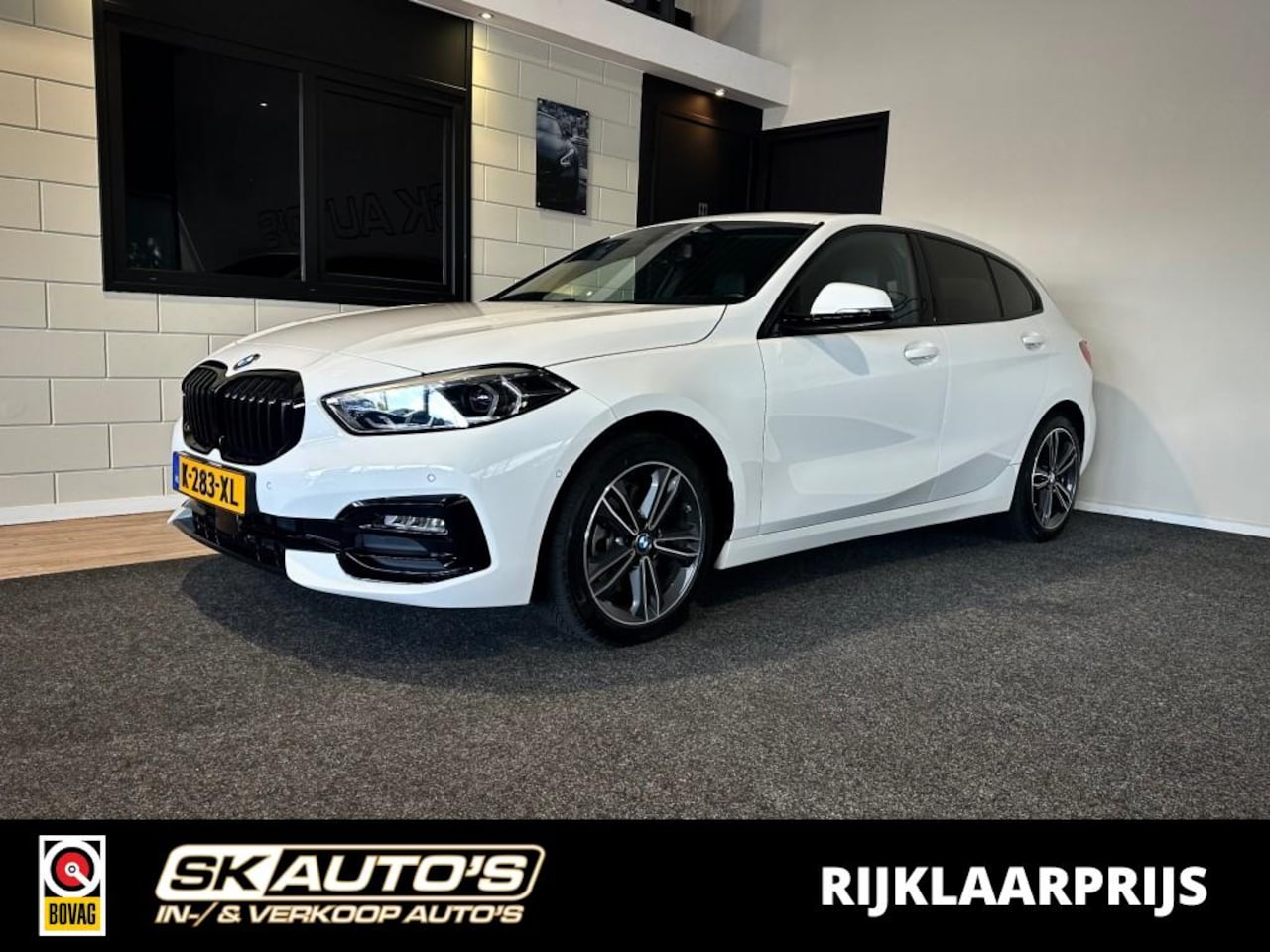 BMW 1-serie - 118I HIGH EXEC l 1STE EIG l STOELVERW l CAMERA l NAVI l SFEERVERL l - AutoWereld.nl