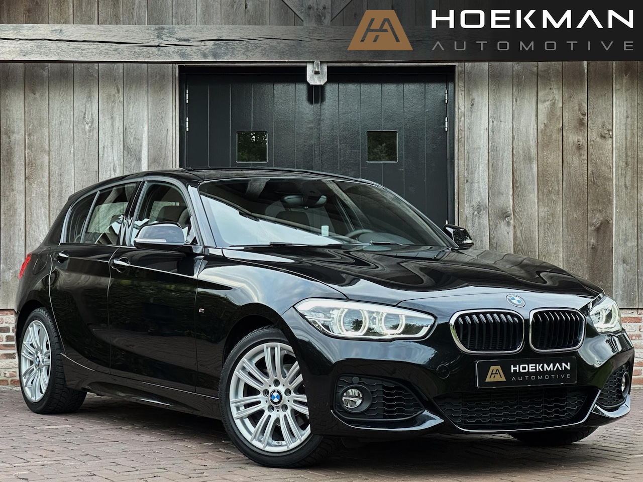 BMW 1-serie - 118i Centennial High Executive M-sport Automaat | Leer, Stoelverwarming, Navigatie, LED, C - AutoWereld.nl