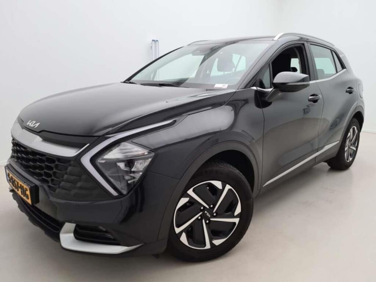 Kia Sportage - 1.6T-GDI 230PK HEV DYNAMICLINE THAAK/NAV/LED - AutoWereld.nl
