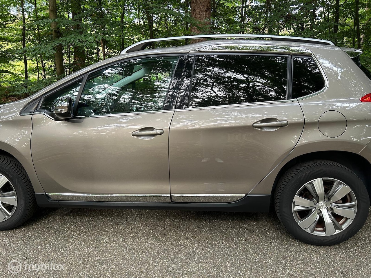 Peugeot 2008 - 1.2 PureTech Allure Pack Premium Plus PANO - AutoWereld.nl