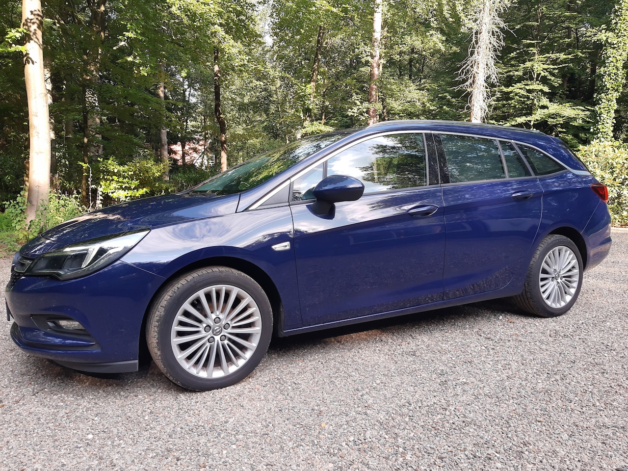 Opel Astra Sports Tourer - 1.0 Business+ 1.0 Business+ Full options: Android Auto/CarPlay; Comfort-pakket; Safety-pakket, Trekhaak - AutoWereld.nl