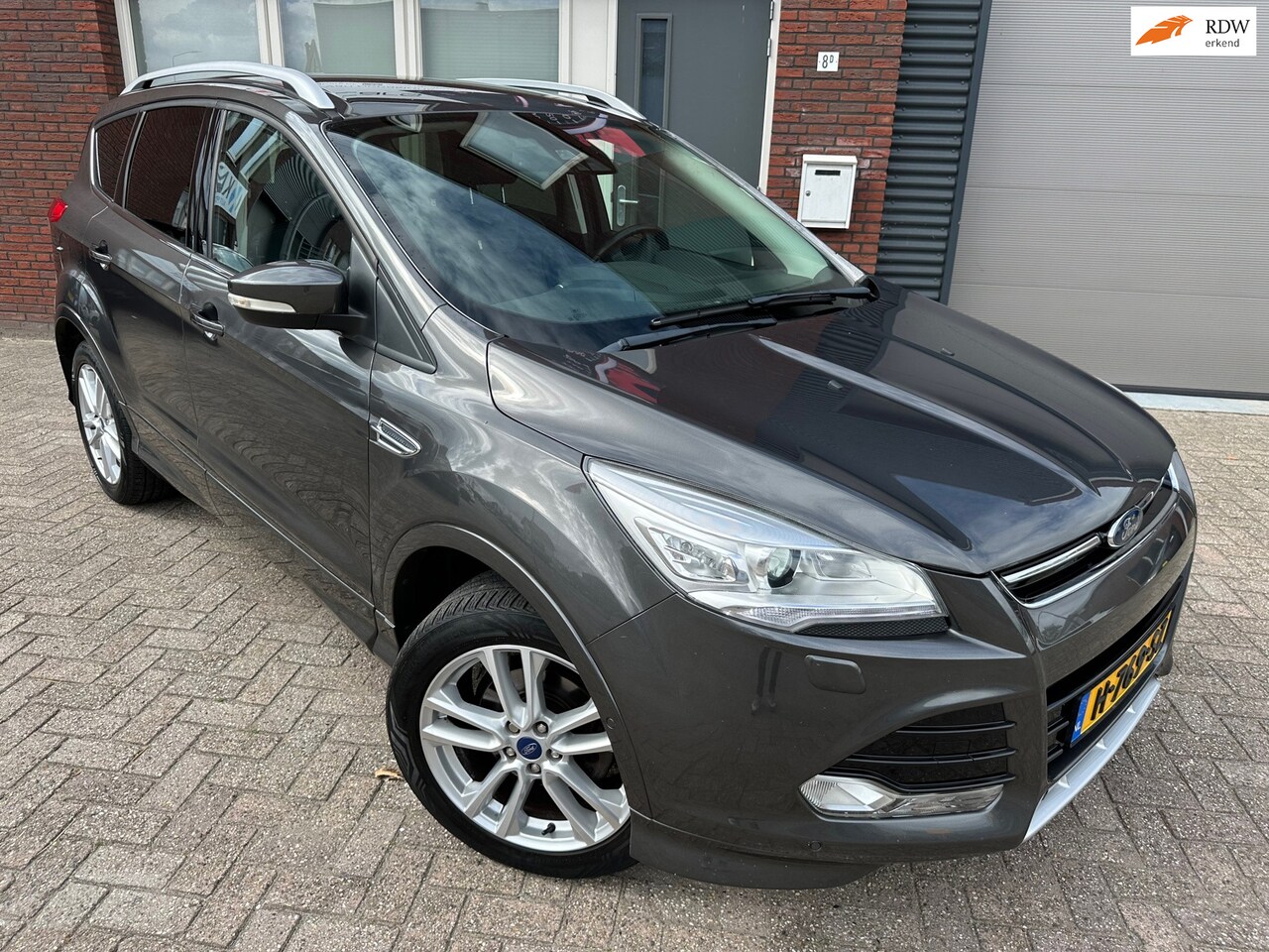 Ford Kuga - 1.5 Titanium Styling Pack / Navi / Camera / Leder / PDC - AutoWereld.nl