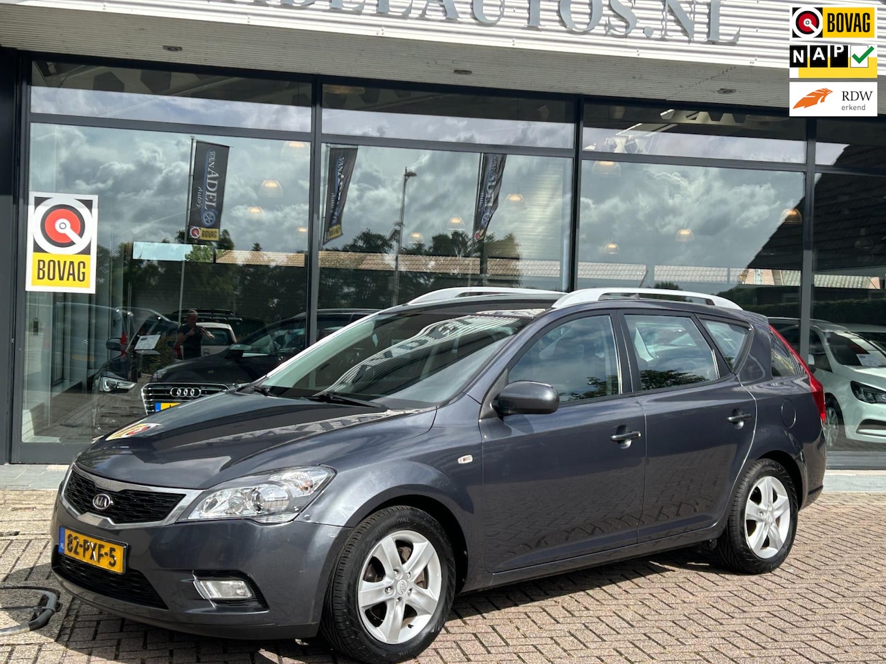 Kia Cee'd Sporty Wagon - 1.4 CVVT Seven Navi Camera Cruise Airco NAP NL-Auto Dealeronderhouden! - AutoWereld.nl