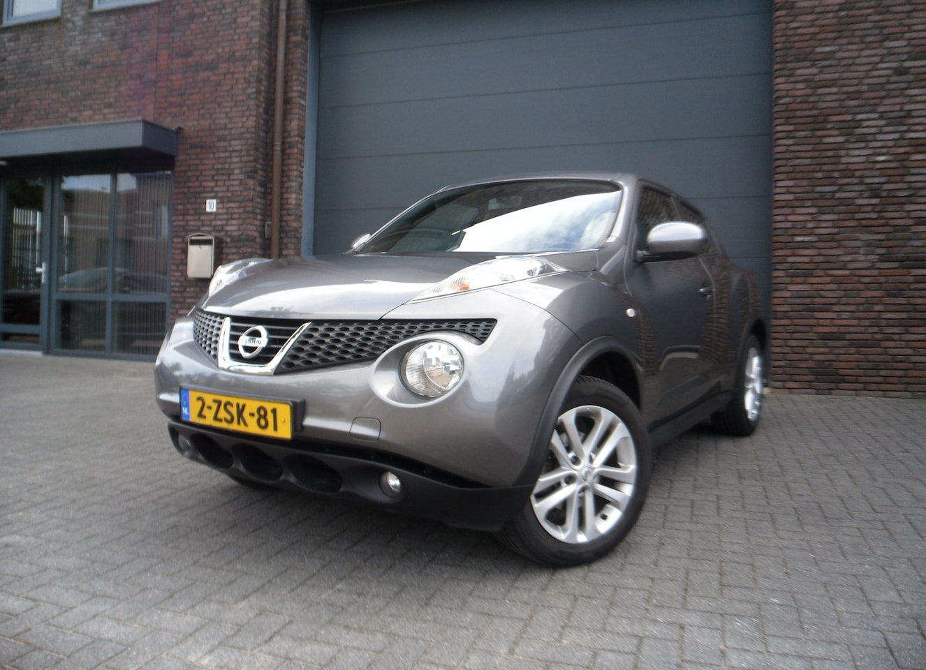 Nissan Juke - 1.6 Acenta 66d KM Cruise Climate - AutoWereld.nl