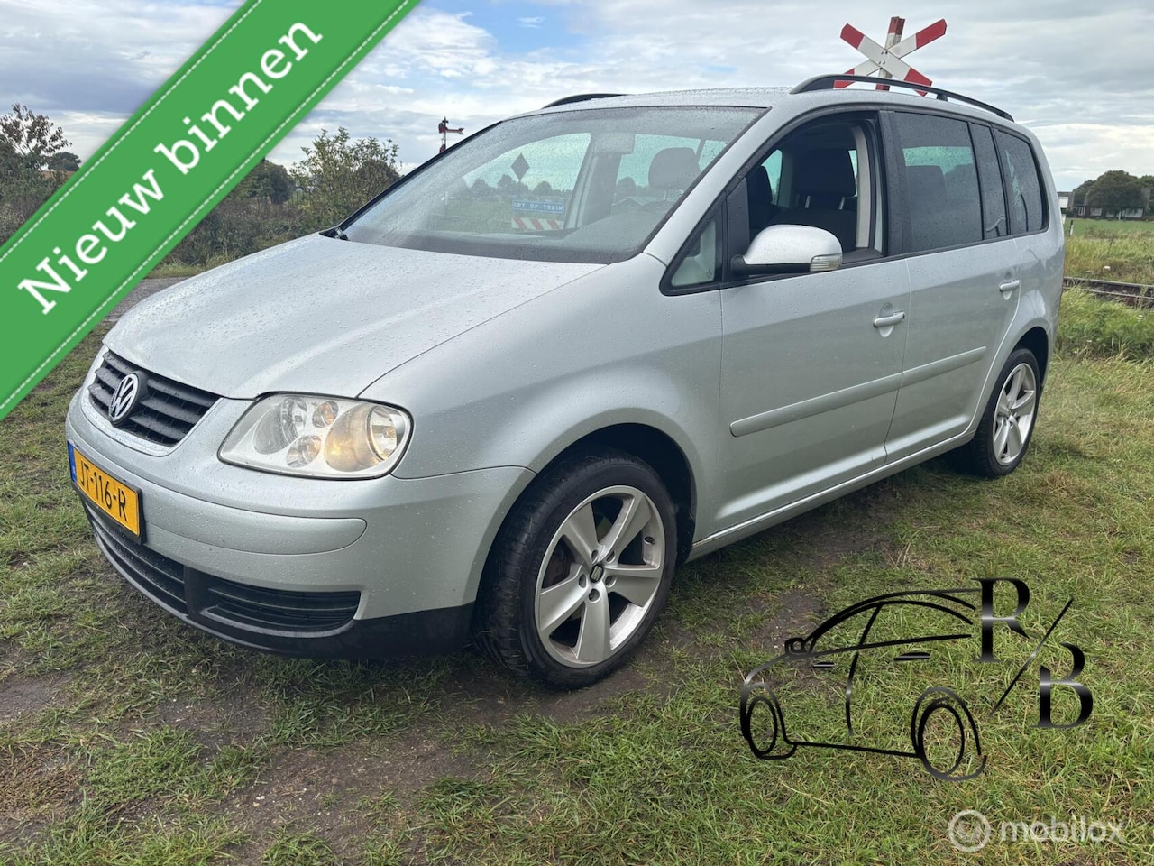 Volkswagen Touran - 1.6 Trendline AIRCO NAVI 7-PERSOONS - AutoWereld.nl